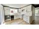 Modern white kitchen with stainless steel appliances and marble countertops at 929 N Bancroft St, Indianapolis, IN 46201