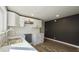 Renovated kitchen featuring white cabinets, marble countertops, and dark-gray walls at 929 N Bancroft St, Indianapolis, IN 46201