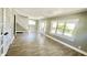 Bright and airy living room with hardwood floors and neutral walls at 929 N Bancroft St, Indianapolis, IN 46201