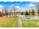 Landscaped backyard with pond, walking paths, and benches at 9600 N 500 E, Pendleton, IN 46064