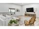 Spacious basement with a large sectional sofa and a large TV at 9600 N 500 E, Pendleton, IN 46064