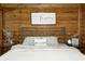 Bedroom with wood walls and metal framed bed at 9600 N 500 E, Pendleton, IN 46064