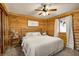 Cozy bedroom with wood walls and a comfortable bed at 9600 N 500 E, Pendleton, IN 46064