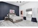 Cozy bedroom with a navy blue accent wall and large window at 9600 N 500 E, Pendleton, IN 46064