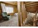Upstairs bedroom with wood walls and a green chair at 9600 N 500 E, Pendleton, IN 46064