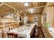 Rustic dining area with wooden table and benches, located near kitchen at 9600 N 500 E, Pendleton, IN 46064