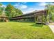 Expansive property showcasing multiple structures, a swing set, manicured lawns, and lush trees on a bright, sunny day at 9600 N 500 E, Pendleton, IN 46064