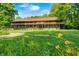 Spacious, rustic two-story home with a covered balcony and a beautifully landscaped front yard at 9600 N 500 E, Pendleton, IN 46064
