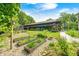 Spacious garden area featuring raised garden beds, landscaping and a full view of the main building at 9600 N 500 E, Pendleton, IN 46064