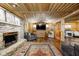 Rustic living room with stone fireplace and wood walls at 9600 N 500 E, Pendleton, IN 46064