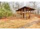 Wooden playset with a slide, swings, and a covered platform at 9600 N 500 E, Pendleton, IN 46064