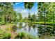 Picturesque pond surrounded by lush trees, offering a tranquil and scenic view at 9600 N 500 E, Pendleton, IN 46064