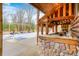 Rustic pool bar with stone base, tiki roof, and seating area at 9600 N 500 E, Pendleton, IN 46064