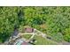 Aerial shot of the pool area, featuring a gazebo, outdoor seating, and picturesque landscaping at 9600 N 500 E, Pendleton, IN 46064