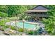 Aerial view of a pool, patio, and surrounding lush landscaping and backyard features at 9600 N 500 E, Pendleton, IN 46064