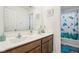 Clean bathroom with double vanity, large mirror, and a bathtub at 1075 Galaxy Ln, Danville, IN 46122