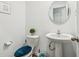 Small bathroom with pedestal sink and toilet at 1075 Galaxy Ln, Danville, IN 46122