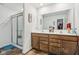 Double vanity bathroom with large mirror and shower at 1075 Galaxy Ln, Danville, IN 46122