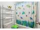 Bathroom with shower/tub, shelf and sea-themed curtain at 1075 Galaxy Ln, Danville, IN 46122