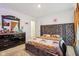 Stylish bedroom with a large bed, dresser, and decorative headboard at 1075 Galaxy Ln, Danville, IN 46122