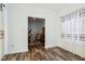View of dining area with hardwood floors and access to adjacent room at 1075 Galaxy Ln, Danville, IN 46122