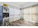 Bright dining room with hardwood floors and view into adjacent room at 1075 Galaxy Ln, Danville, IN 46122