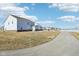 Two story home with paved pathway and partial community view at 1075 Galaxy Ln, Danville, IN 46122