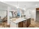 Open concept kitchen with island and view of living room at 1075 Galaxy Ln, Danville, IN 46122