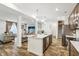 Open concept kitchen with island and view of living room at 1075 Galaxy Ln, Danville, IN 46122