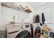 Bright laundry room, Samsung washer and dryer, and ample shelving at 1075 Galaxy Ln, Danville, IN 46122