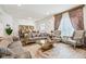 Elegant living room with plush sofas, coffee table, and large windows at 1075 Galaxy Ln, Danville, IN 46122