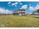 Large backyard with lush green grass and a trampoline at 11726 E 75Th St, Indianapolis, IN 46236