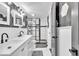 Modern bathroom with hexagon tile and a double vanity at 11726 E 75Th St, Indianapolis, IN 46236