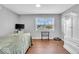 Charming bedroom with a twin bed, white armoire, and a view of the neighborhood at 11726 E 75Th St, Indianapolis, IN 46236