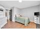 Cozy bedroom with a twin bed, white armoire, and access to a full bathroom at 11726 E 75Th St, Indianapolis, IN 46236