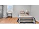 Bright bedroom with a twin-size bed, built-in desk, and plenty of natural light at 11726 E 75Th St, Indianapolis, IN 46236