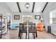 Dining area with a wooden table, chairs, and access to the backyard at 11726 E 75Th St, Indianapolis, IN 46236
