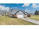 Brick ranch home with gray siding, attached garage, and landscaped lawn at 11726 E 75Th St, Indianapolis, IN 46236
