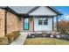 Inviting front entry with teal door, brick facade, and landscaping at 11726 E 75Th St, Indianapolis, IN 46236