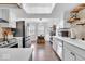 Modern kitchen with white cabinets, stainless steel appliances, and breakfast nook at 11726 E 75Th St, Indianapolis, IN 46236