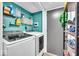 Convenient laundry room with washer, dryer, and shelving at 11726 E 75Th St, Indianapolis, IN 46236