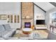 Living room with brick fireplace, vaulted ceiling, and ample natural light at 11726 E 75Th St, Indianapolis, IN 46236