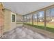 Bright sunroom with tiled floors and plenty of windows overlooking the backyard at 11726 E 75Th St, Indianapolis, IN 46236