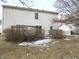 Backyard featuring a two-tiered wooden deck, mature shrubbery, and a charming garden at 1217 Legacy Ln, Indianapolis, IN 46234
