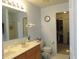 Bathroom with double sink vanity, large mirror, and tile flooring at 1217 Legacy Ln, Indianapolis, IN 46234