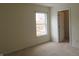 Neutral bedroom with window and view of trees at 1217 Legacy Ln, Indianapolis, IN 46234