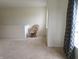 Open and airy bonus room with neutral walls, plush carpet, and ample natural light at 1217 Legacy Ln, Indianapolis, IN 46234