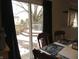 View of the dining table and the sliding glass door to the outdoor deck at 1217 Legacy Ln, Indianapolis, IN 46234