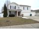 Traditional two-story home boasts a two-car garage and well-maintained landscaping, perfect for a Gathering at 1217 Legacy Ln, Indianapolis, IN 46234