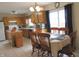 Eat-in kitchen with stainless steel appliances, tile floors, and light wood cabinets at 1217 Legacy Ln, Indianapolis, IN 46234